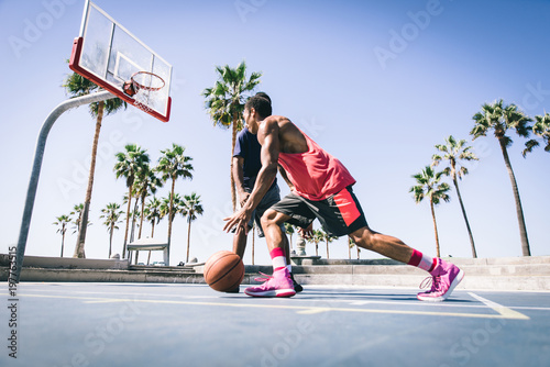 Two basketball players playing outdoor in LA