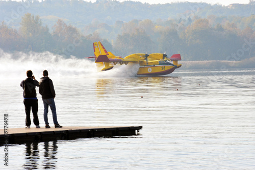 Varese Lake, Italy, october/28/2017, Canadair take water in the lake
