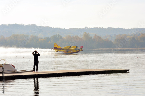 Varese Lake, Italy, october/28/2017, Canadair take water in the lake