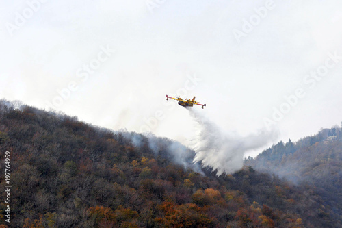 Varese, Campo dei Fiori, Italy, october/28/2017, Canadair in action on a wildfire
