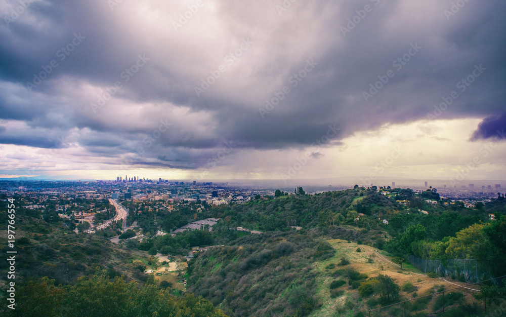 Stunning Panoramic aerial view of Los Angeles in a rainy stormy weather overlooking Downtown, Hollywood and other areas.