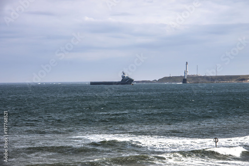 Ship entering harbour in Aberdeen, Scotland, UK. August 2015