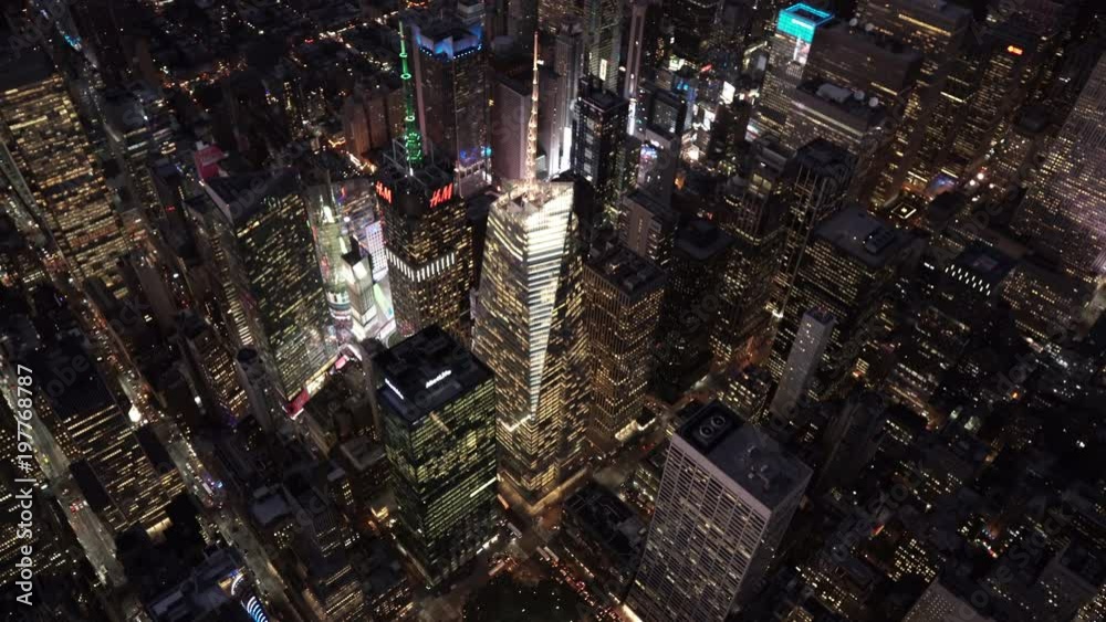 New York City high angle aerial view of 42nd Street and 5th Avenue at night with Times Square in background