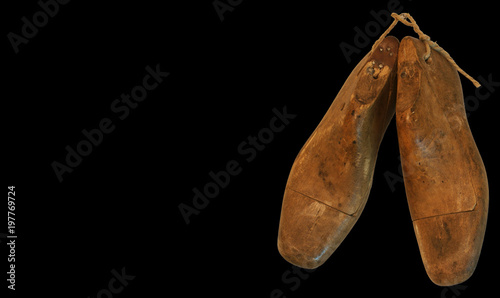 Background whit an old pair of shoe Lasts (foot shaped forms used to make shoes)