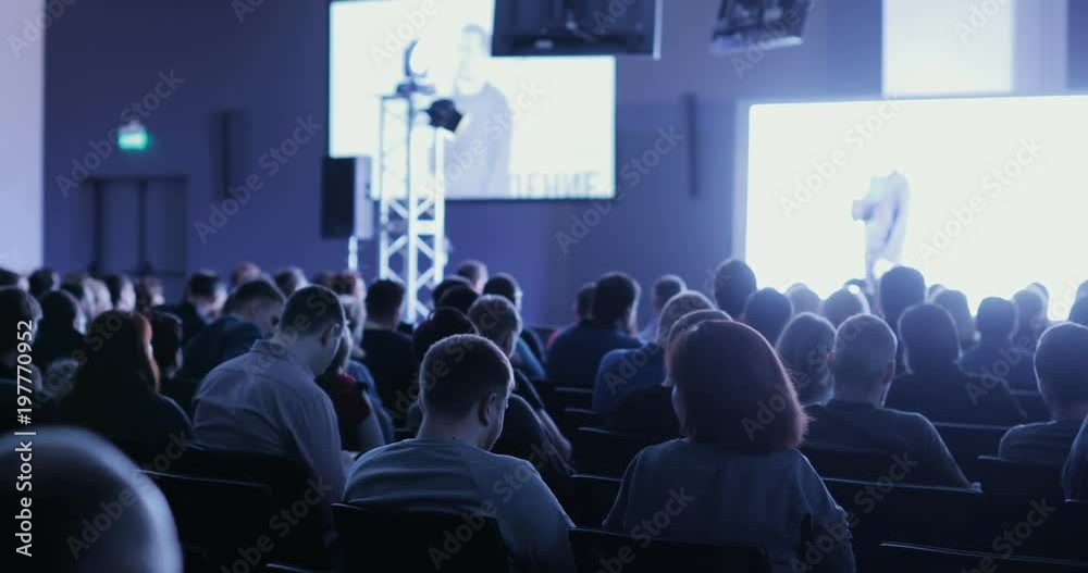 people at a conference or presentation, workshop, master class photograph. Back view