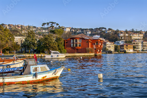 Istanbul, Turkey, 17 April 2009: Waterside mansions and boats at bosphorus.