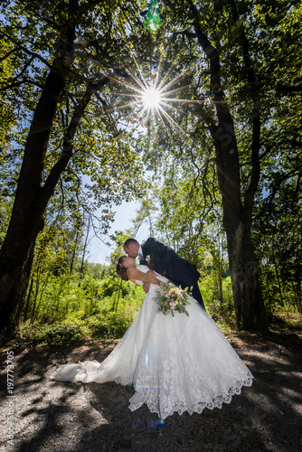 Bride and Groom kissing each other photo