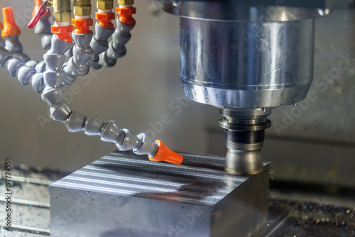 The CNC milling machine cutting the raw material by face milling tool.