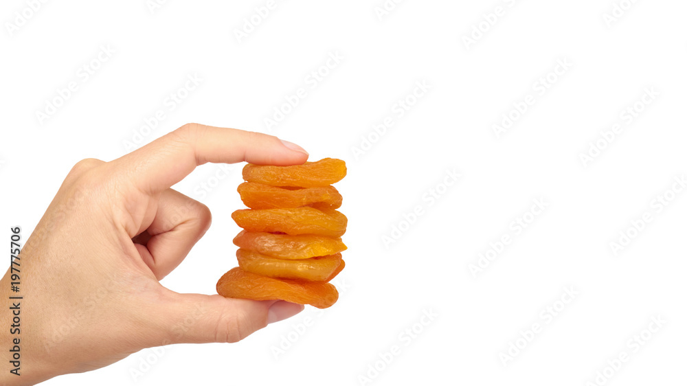 delicious and healthy dried apricots in hand isolated on white background, healthy sweet snack. copy space, template delicious and healthy dried apricots in hand isolated on white background, healthy sweet snack. copy space, template