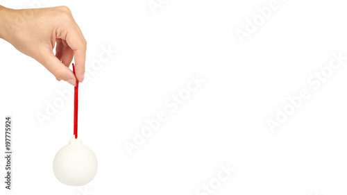 Cristmas decoration, glass ceramic white ball in hand isolated on white background. New Year object. copy space, template
