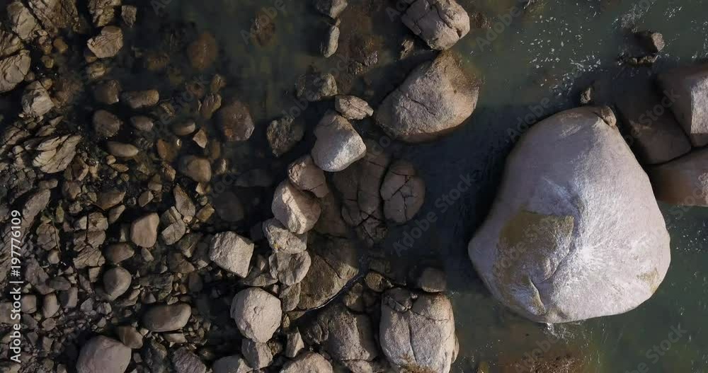 4K high quality aerial video footage of Western Cape's coast, Paternoster beach boulders, sandy sea front and Atlantic Ocean views in the background near Cape Town, South Africa on summer morning