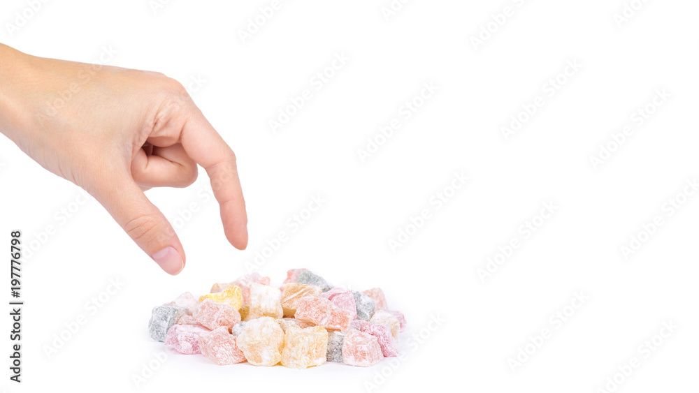 Turkish delight sweets in hand isolated on the white background, colored candy, natural product. copy space, template Turkish delight sweets in hand isolated on the white background, colored candy, natural product. copy space, template