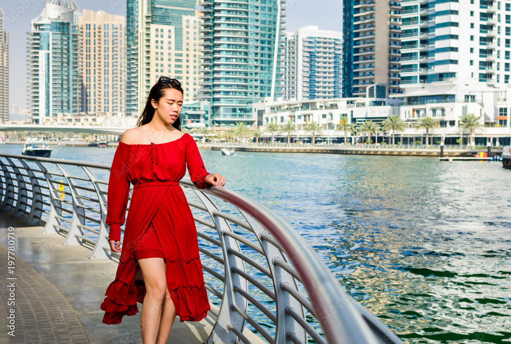 Girl having a walk at Dubai marina, UAE