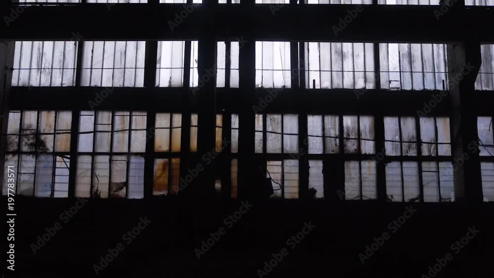 Big windows from inside of an old and abandoned warehouse Big windows from inside of an old and abandoned warehouse