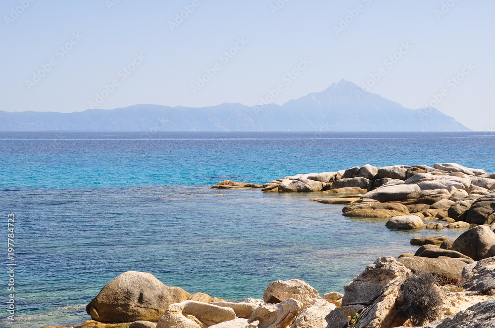 Shore of Sithonia near Sárti, Greece. In the background you can see Mount Áthos.
