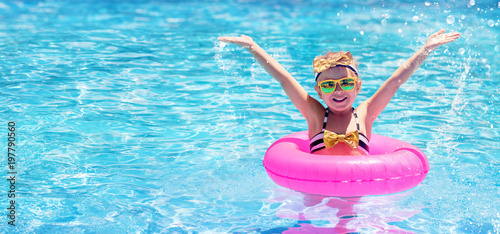 Happy Child Swimming In The Pool
