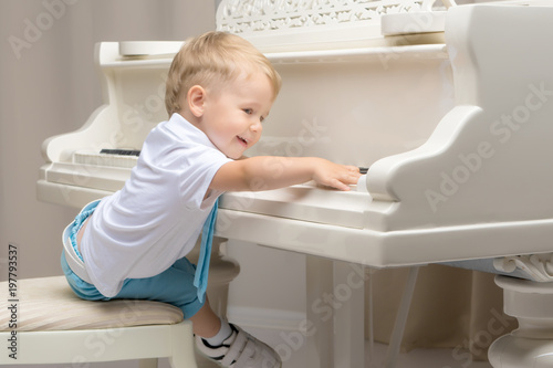 Little boy playing the piano