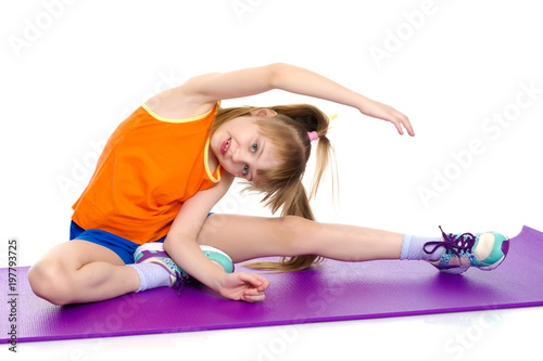 The gymnast perform an acrobatic element on the floor.