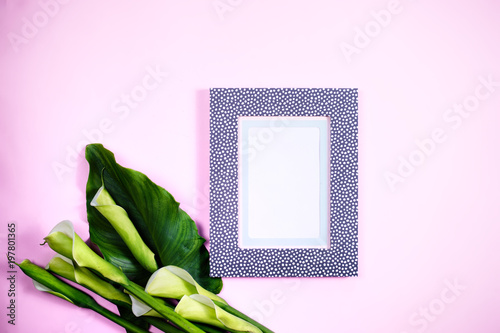 Modern blank frame top view calla flowers photo