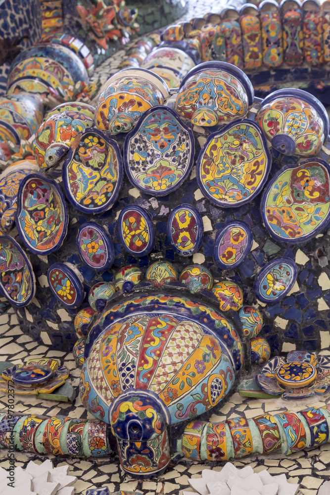 Mexican talavera style pottery used in altar and fountain. This colorful handmade maiolica have a blurred appearance as they fuse slightly into the glaze. Vibrant colors and unique designs in each one
