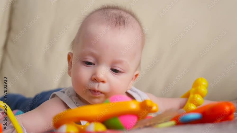 Funny little child playing with toys by the home Funny little child playing with toys by the home