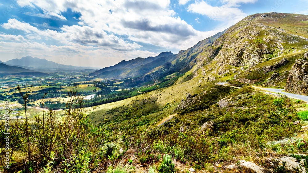 Fototapeta premium Spectacular view of Franschhoek Pass, also called Lambrechts Road R45, which runs along Middagskransberg between Franschhoek and Villiersdorp in the Western Cape Province of South Africa