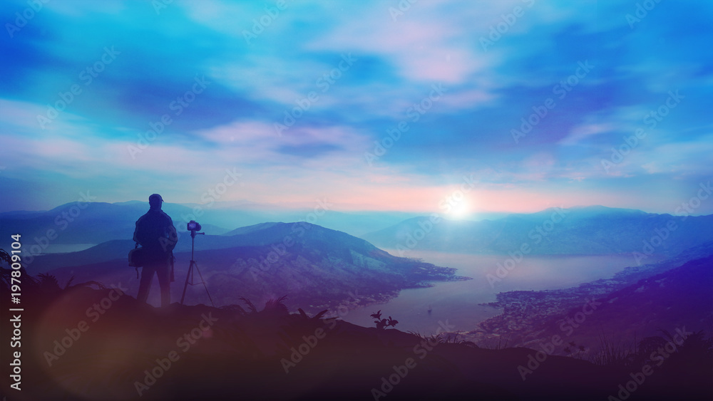 Obraz premium The Photographer Shoots A Magical Sunrise In The Mountains