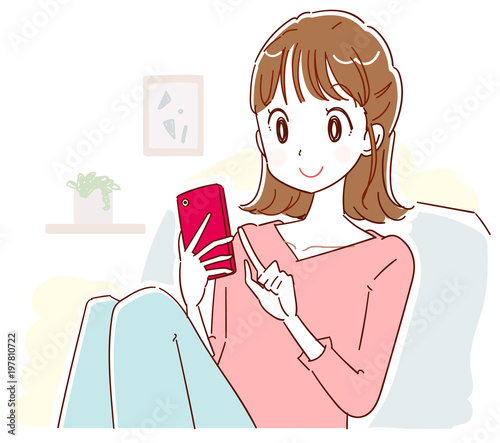 A young woman is relaxing indoors while using a smartphone