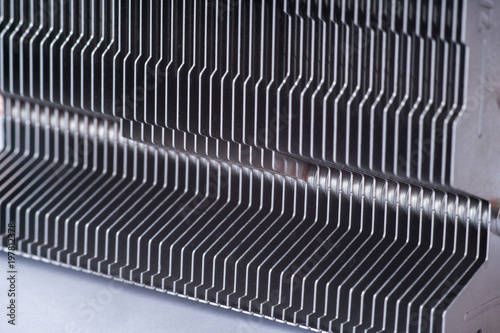 Aluminum radiator with copper heat pipe close-up with beautiful bokeh photo