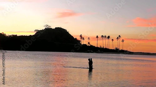 Sunset of Nacpan beach. The island of Palawan. Philippines. photo