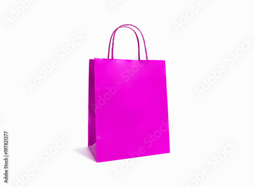 Pink paper bag isolated on white background.