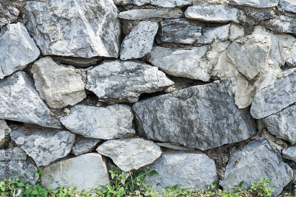 Fototapeta premium Rock wall or Stone wall for protect wave breaker at the sea.