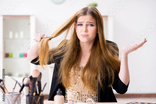 Young woman frustrated at her messy hair