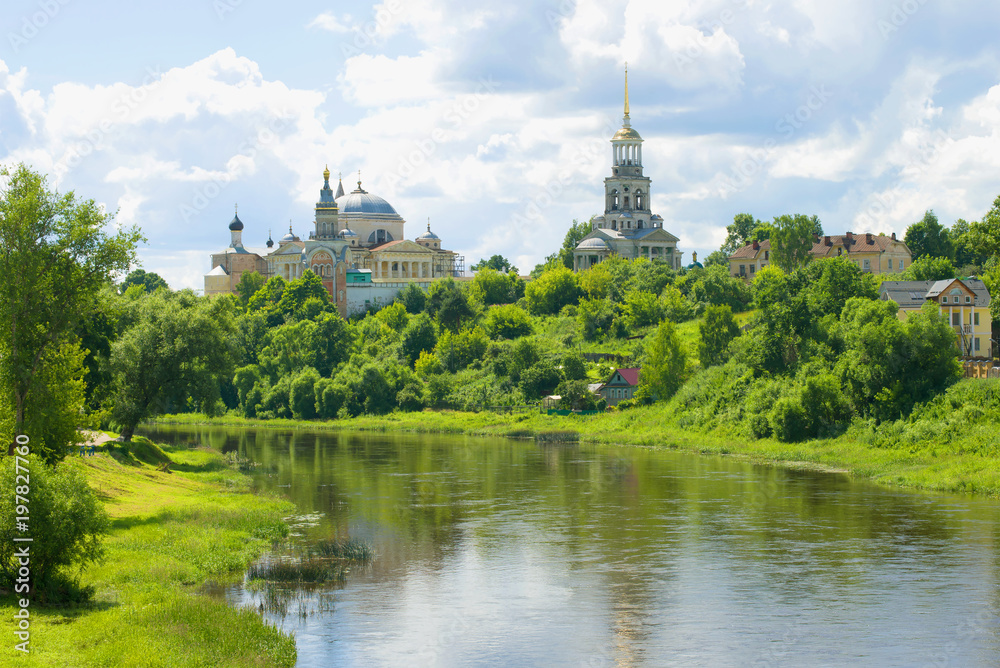 Tvertsa river and Borisoglebsky monastery on a sunny July day. Torzhok, Russia