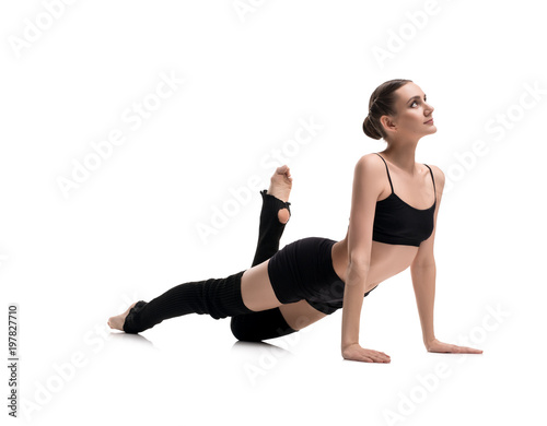 Girl in black sportswear doing fitness view