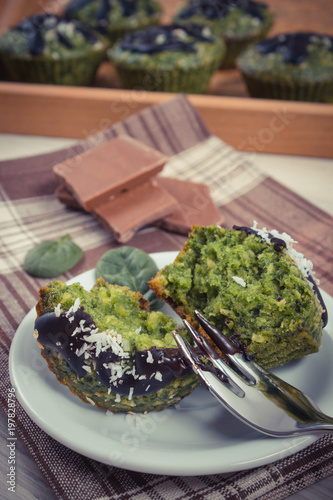Vintage photo, Fresh muffins with spinach, desiccated coconut and chocolate glaze