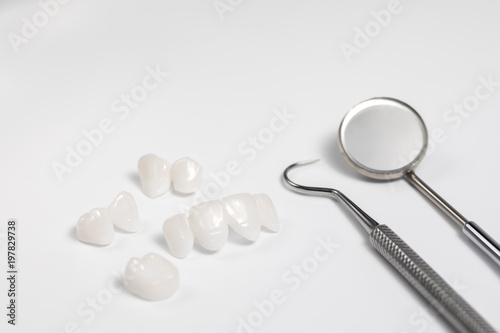 Dental tools and tooth implant isolated on white background