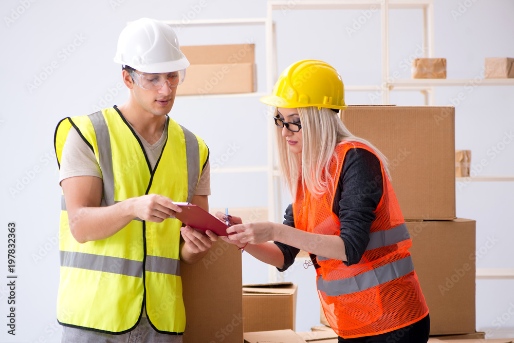 Delivery contractor delivering boxes to office Delivery contractor delivering boxes to office