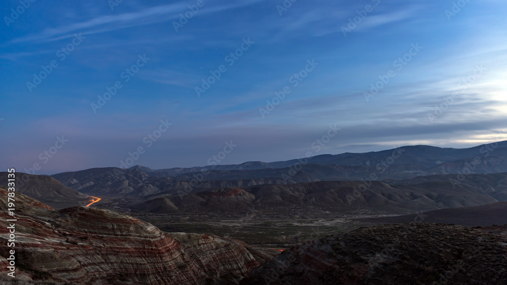 Amazing striped red mountains after sunset Amazing striped red mountains after sunset