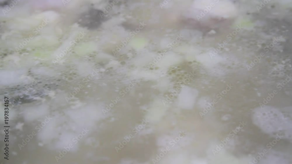 Close-up of cooking soup. Filling in the boiling broth is fat. Close-up of cooking soup. Filling in the boiling broth is fat.