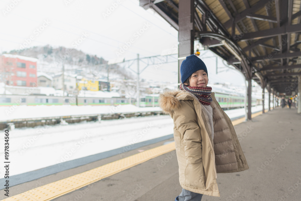 Fototapeta premium Cute asian child at railway station