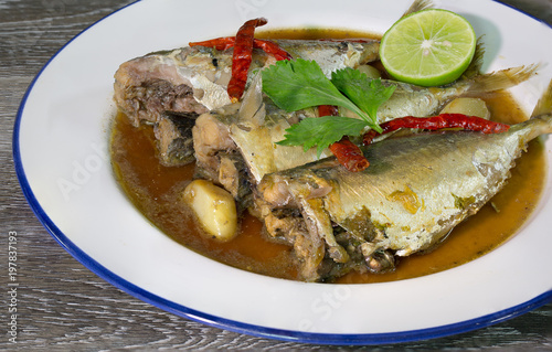 Mackerels in sweet and sour soup with spicy Thai food in white dish