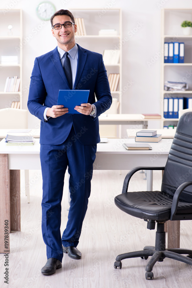 Fototapeta premium Young handsome businessman employee working in office at desk