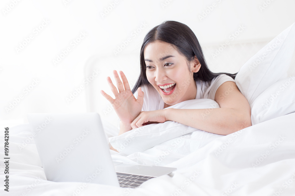 Attractive asian woman using laptop for live chat at home. People with lifestyle concept. Attractive asian woman using laptop for live chat at home. People with lifestyle concept.