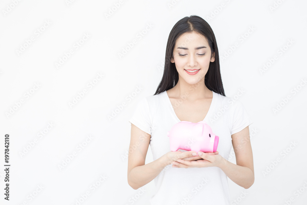 Portrait of Attractive female holding piggy bank on white background. Portrait of Attractive female holding piggy bank on white background.