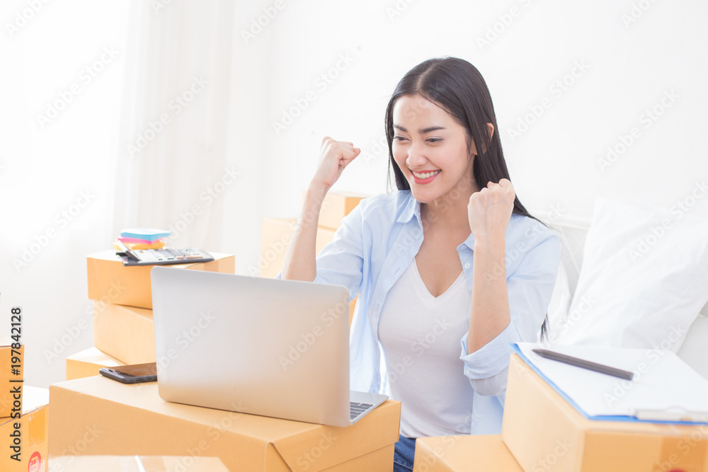 Young Asian Woman success for online business, Young Owner Woman Start up for Business Online. People with online shopping SME entrepreneur or freelance working concept. Young Asian Woman success for online business, Young Owner Woman Start up for Business Online. People with online shopping SME entrepreneur or freelance working concept.