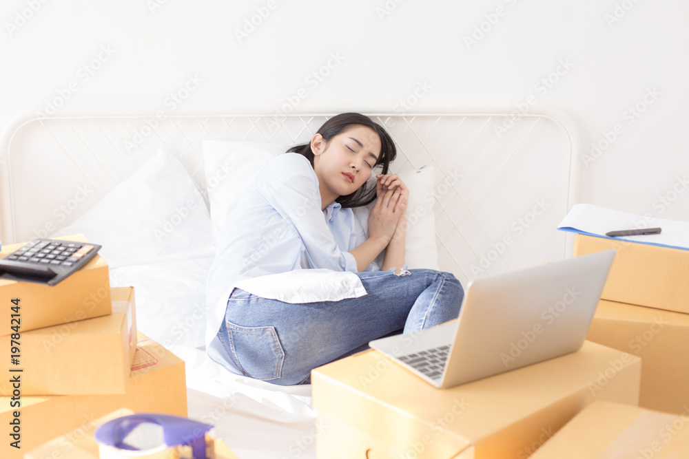 Young Asian Woman Working at home, Young Owner Woman Start up for Business Online. People with online shopping SME entrepreneur or freelance working concept. Young Asian Woman Working at home, Young Owner Woman Start up for Business Online. People with online shopping SME entrepreneur or freelance working concept.