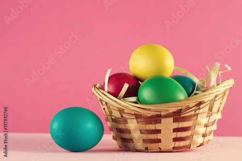 colorful easter egg in basket