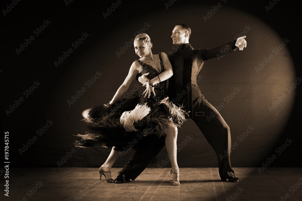 dancers in ballroom isolated on black background