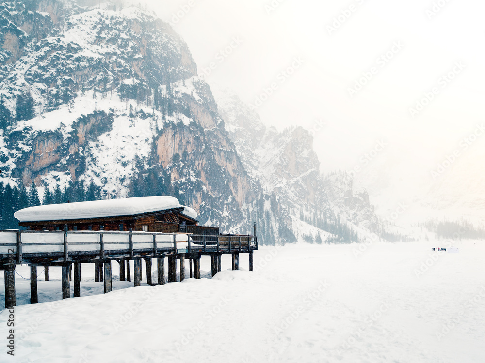 Braies lake nestled in the snow. Magic corner of the Dolomites, Bolzano, italy Braies lake nestled in the snow. Magic corner of the Dolomites, Bolzano, italy